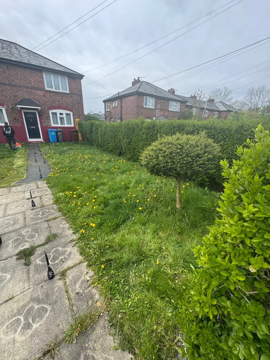 Manchester Green Glow at work — mowing and clearing an overgrown front garden in Manchester